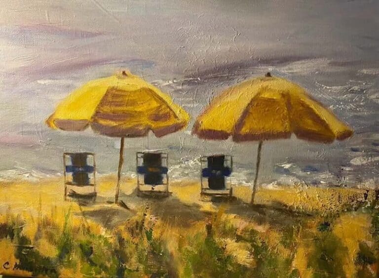 A painting of two yellow umbrellas on a sandbar by Carol Hamilton.