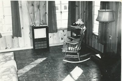 A chair in a living room back in the 1970's.