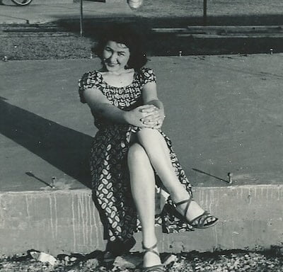 Carol's mother sitting outside.